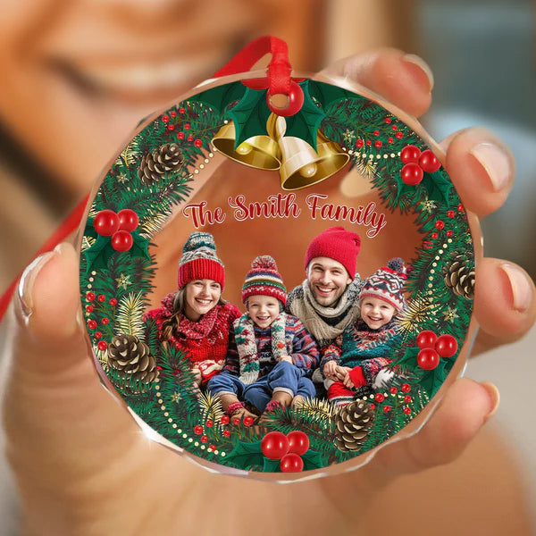 Hand holding a personalized family group photo holiday keepsake