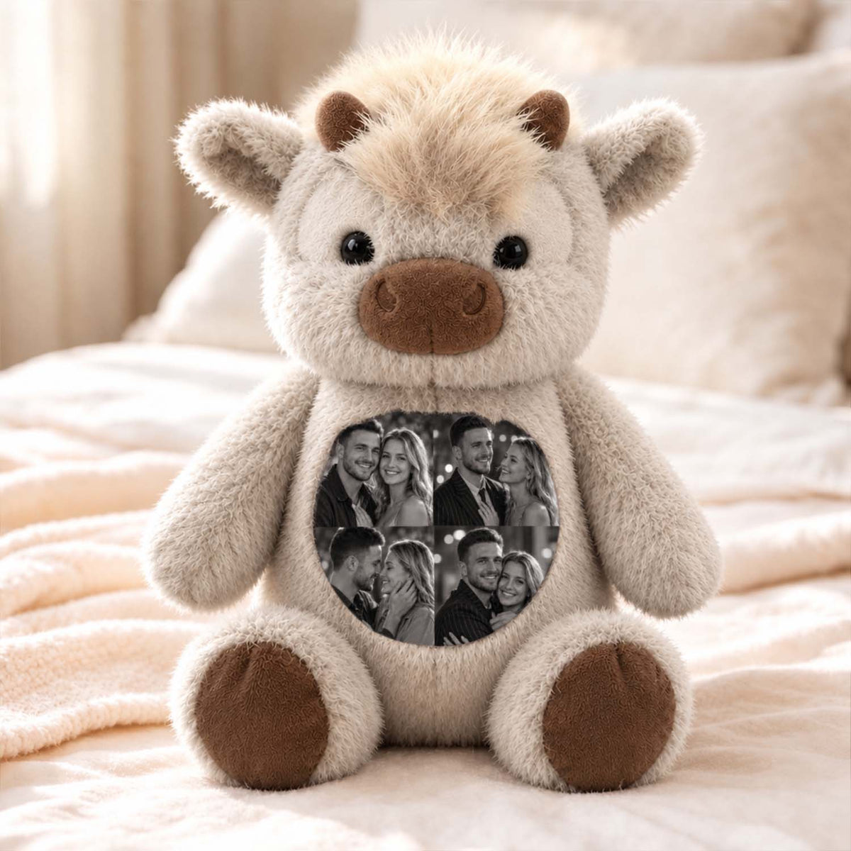 Light-color personalized cow plush displayed on a bed