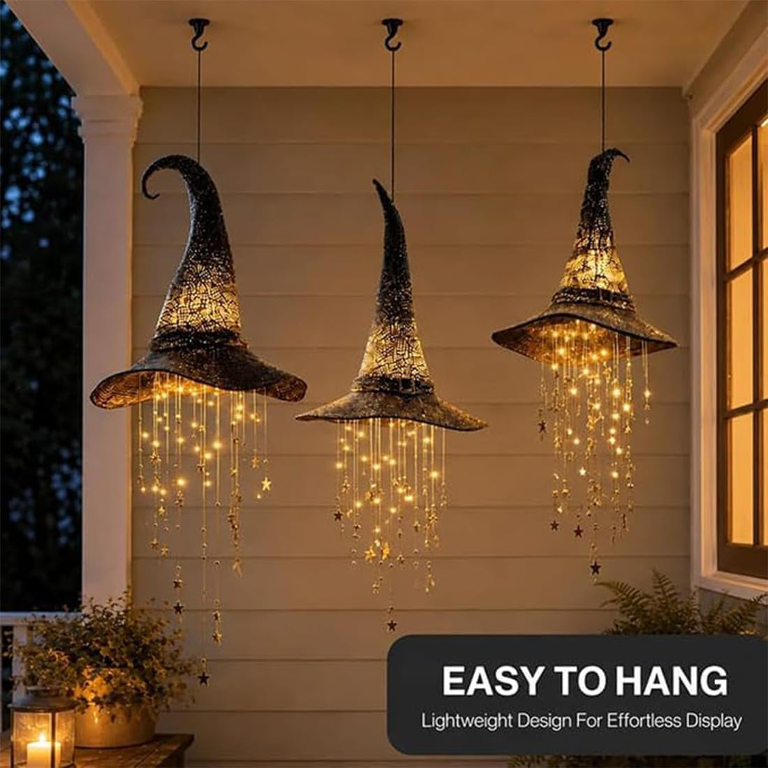 Three LED witch hats suspended in a covered porch display