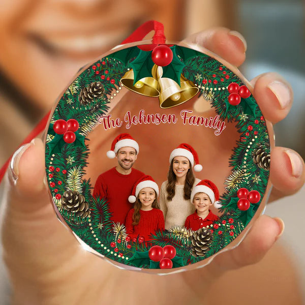 Close-up of a round custom family photo Christmas tree ornament