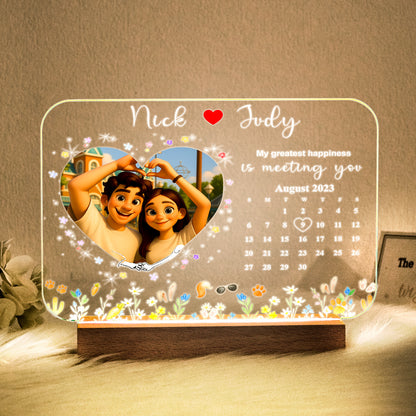 Cartoon-style couple portrait on a personalized LED photo night light with wooden base