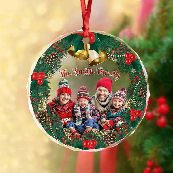 Close-up of a family group photo Christmas ornament on a branch