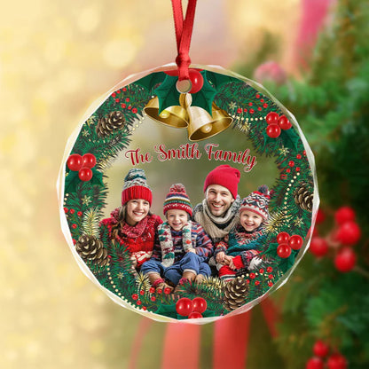 Close-up of a family group photo Christmas ornament on a branch