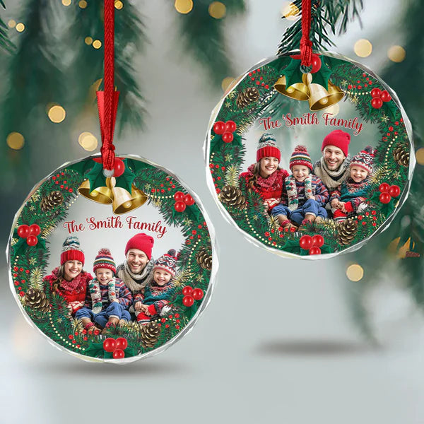 Two personalized family photo ornaments displayed on a Christmas tree