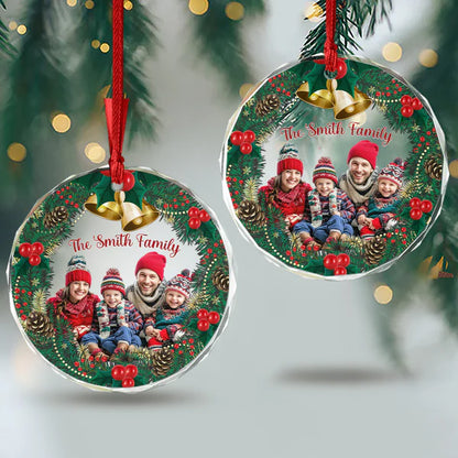 Two personalized family photo ornaments displayed on a Christmas tree