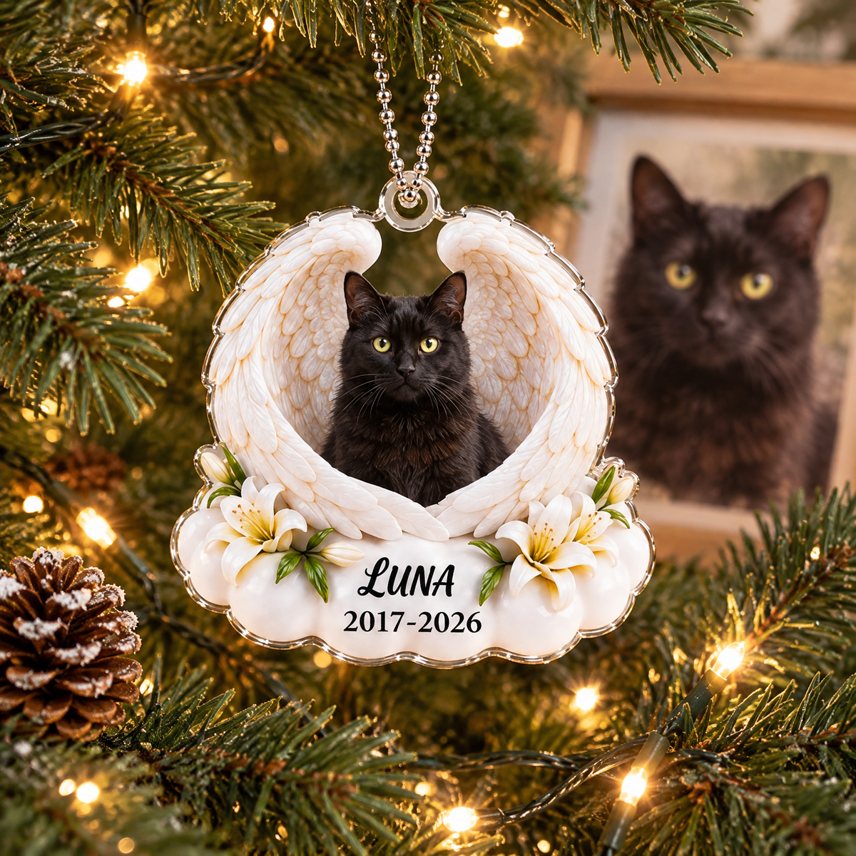 Black cat memorial photo ornament framed by angel wings and lilies