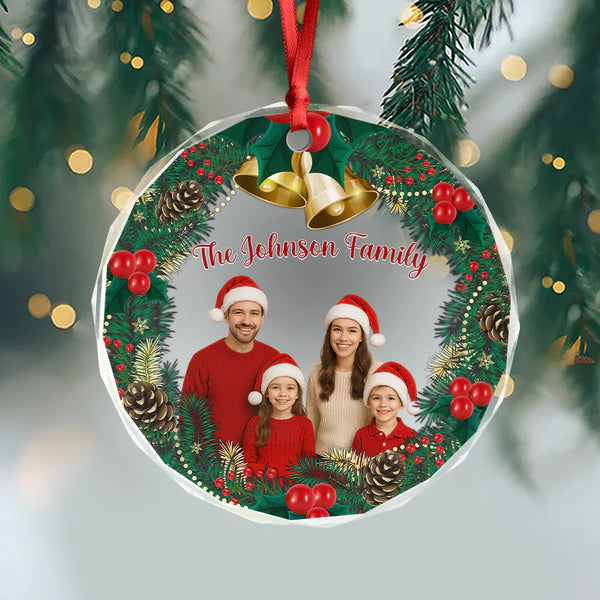 Personalized family ornament hanging from a red ribbon