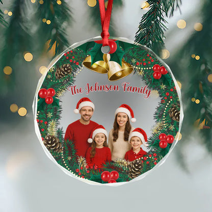 Personalized family ornament hanging from a red ribbon