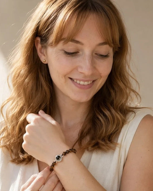 Woman wearing the Wakera frosted stone photo projection bracelet