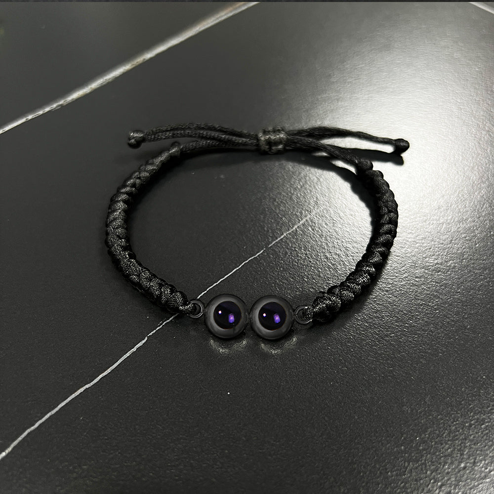 Bracciale personalizzato con proiezione a doppio ciondolo in corda intrecciata con nodo serpente